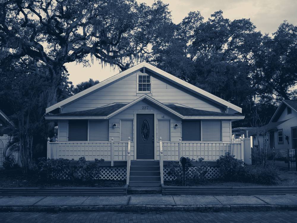 A yellow wooden house under trees, Safety Harbor, Florida
